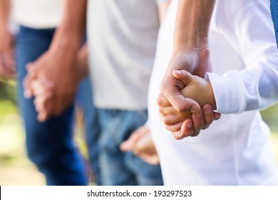 Family Holding Hands Close Up