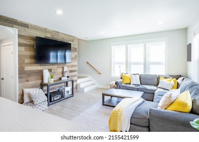 Family home living room with grey sofa and yellow accents