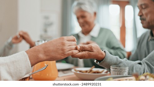 Family, home and pray for dinner in table with food for grace, grateful and gratitude. People, respect and holding hands with bonding for love, support and care on thanksgiving gathering or reunion - Powered by Shutterstock