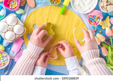 Family Homemade Holiday Easter Pastry Concept. Baking Background With Mom And Daughter Child Hands, Flatlay Top View. With Dough, Cupcake Forms, Cookie Cutters And Sugar Sprinkles, Ingredients