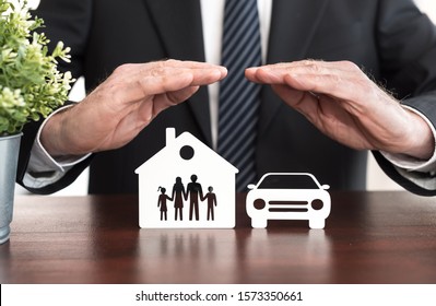 Family, House And Car Protected By Hands - Concept Of Life, Home And Auto Insurance