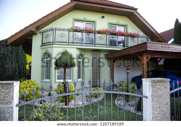 Family house in\
Europe with car and\
garden