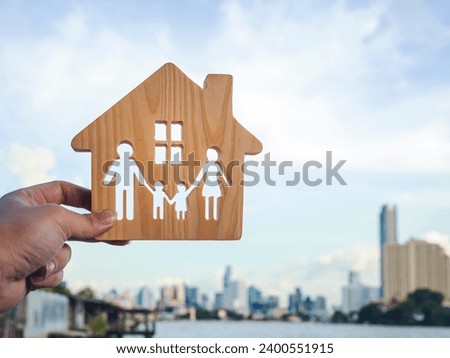 Family and house model, Security protection and health insurance. The concept of family home, protection, travel insurance, house insurance.
