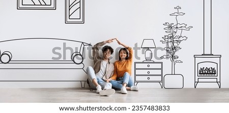 Family Housing. Cheerful Asian Young Couple Dreaming About New Home, Joining Hands Like House Roof Above Them, Sitting Near White Wall With Illustration Of Living Room Interior. Collage, Panorama