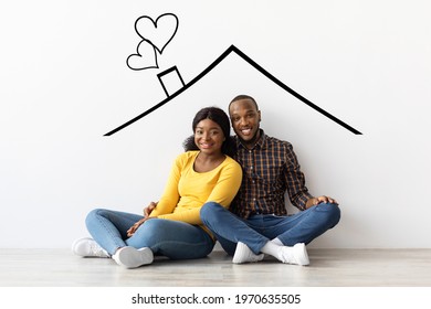 Family Housing  Happy Black Couple Sitting Near White Wall With Drawn Roof  Smiling Young Romantic African American Spouses Imagining Their New Home  Planning Relocation  Creative Collage
