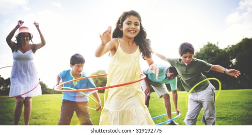 Family Hula Hooping Relaxing Outdoors Concept