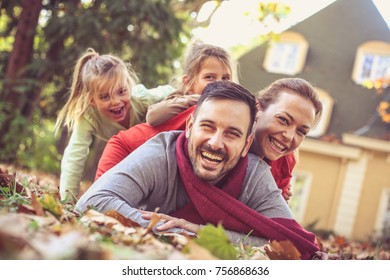 Family Human Pyramid. Autumn Season. 