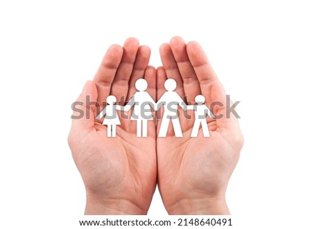 Family insurance concept with paper family cutout in hands isolated on white background with clipping path