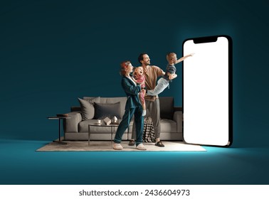 Family interacting with huge 3D model of smartphone in living room against blue background. Online shopping, delivery services, sales. Modern technologies. Mockup for ad, text, design, logo - Powered by Shutterstock