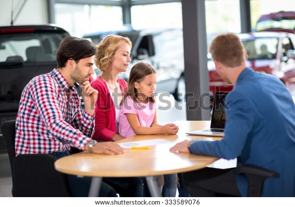 \
Family  interested in purchasing new car\
listens car agent in car\
showroom