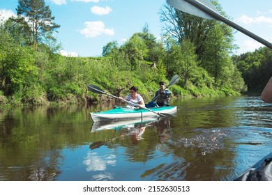 Family Kayak Trip. An Elderly Married Couple Rowing A Boat On The River, A Water Hike, A Summer Adventure. Age-related Sports, Mental Youth And Health, Tourism, Active Old Age