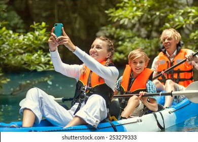 Family Kayaking And Makes Selfie