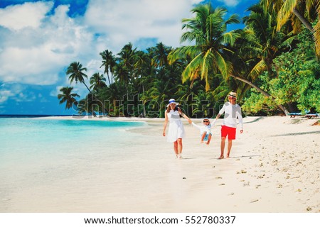 Similar – Image, Stock Photo Mother enjoying summer vacations holding, playing and lifting his infant baby boy son high in the air on sandy beach on Lanzarote island, Spain. Family travel and vacations concept