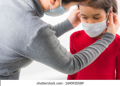 Family With Kids In Face Mask  On White Background. Mother And Child Wear Facemask During Coronavirus Outbreak. Covid-19 Coronavirus Concept. Virus And Illness Protection.