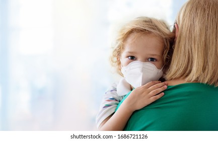 Family With Kids In Face Mask In Shopping Mall Or Airport. Mother And Child Wear Facemask During Coronavirus And Flu Outbreak. Virus And Illness Protection, Hand Sanitizer In Public Crowded Place.