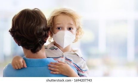 Family with kids in face mask in shopping mall or airport. Father and child wear facemask during coronavirus and flu outbreak. Virus and illness protection, hand sanitizer in public crowded place.