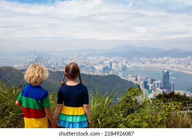 Family With Kids Hiking In Hong Kong Mountains. Beautiful Landscape With Hills, Sea And City Skyscrapers In Hong Kong, China. Outdoor Activity In The Nature For Parents And Children.