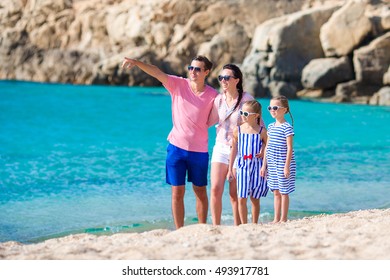 Family With Kids On The Beach In Greece