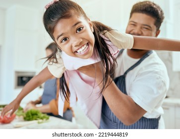 Family, Kitchen And Cooking Together, Smile In Portrait And Father Lift Child, Learning And Chef Skill With Parents And Kid. Happy, Food Preparation And Meal, Man Holding Child And Mother With Veg.