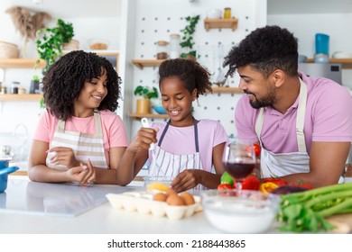 Family In Kitchen Making Morning Breakfast Together. Happy Family In The Kitchen Having Fun And Cooking Together. Healthy Food At Home.