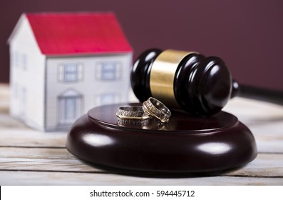 Family Law Concept. Divorce. Gavel, House And Rings 