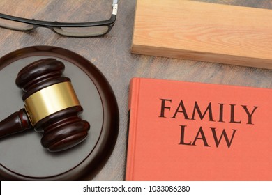 Family Law Wooden Gavel And Red Book