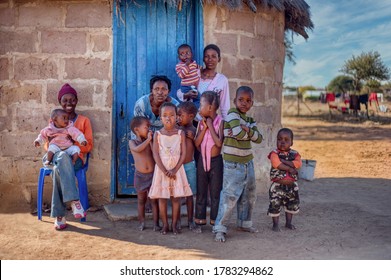 Family life group of African kids and mother in a village in Botswana