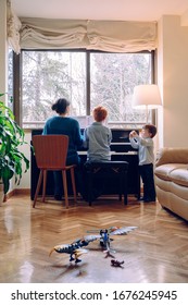 Family Lifestyle Spending Time Together Indoors. Children With Musical Virtue And Artistic Curiosity. Educational Musical Activities For Little Kid. Mom Teaching Her Son At Home Piano Lessons.