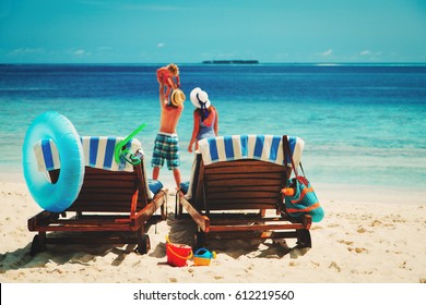 family with little child on beach vacation