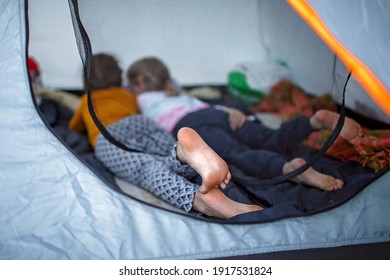 Family Local Getaway. Kid Sitting In The Camping Tent At Campsite And Looking At Sea, Healthy Active Lifestyle, Safe Summer, Stay Location Concept