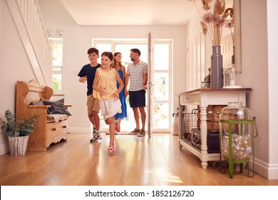 Family Looking Around New Home Before They Move In - Powered by Shutterstock