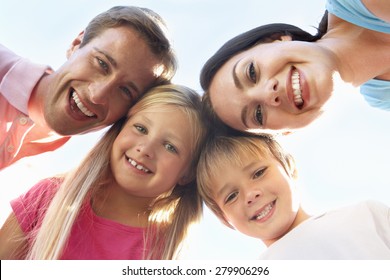 Family Looking Down Into Camera