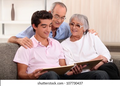 Family Looking Through Photo Album