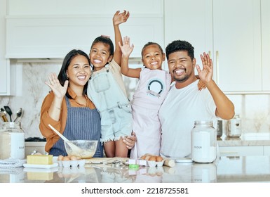 Family, Love And Baking Together In Kitchen With Smile, Happy And Wave With Ingredients On Counter Or Table. Portrait Of Girl Kids, Mother And Father Enjoy Cooking Or Bake While Bonding In Home