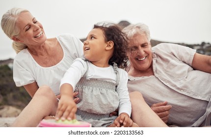 Family, Love And Beach Fun With Kid And Grandparents Enjoying The Sand, Free Time And Bonding On Summer Holiday. Senior Woman And Man Enjoying Travel And Playing With Girl Grandchild On A Vacation