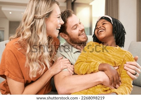 Family, love and hug, laughing and happiness with care and funny, bonding and couple with black child together at family home. Happy family, adoption or foster care and interracial with relationship.