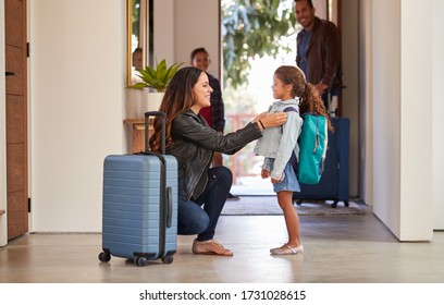 Family With Luggage Opening Door And Leaving Home For Vacation