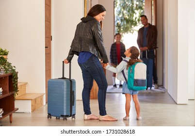 Family With Luggage Opening Door And Leaving Home For Vacation