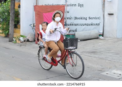 A Family Make A School Run By Bicycle On April 22, 2011 In Bangkok, Thailand. The Government Plans To Build Cycle Lanes And Encourage The Use Of Bicycles To Combat Road Congestion.