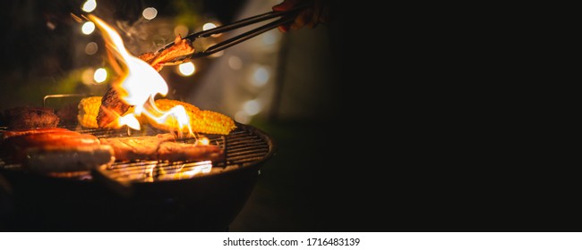 Family Making Barbecue In Dinner Party Camping At Night