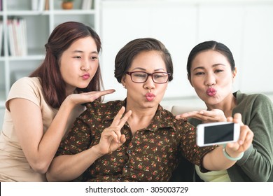 Family Making Duck Face While Taking A Selfie