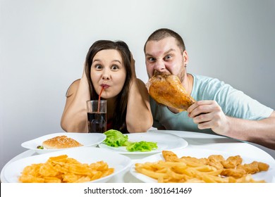 Family: A man and a woman have dinner together at a fast food table