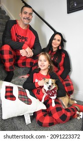 Family In Matching Christmas Pajamas Posing Indoors For The Family Portrait, Taken On December 8, 2021, Chillicothe, Ohio, USA