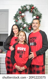 Family In Matching Christmas Pajamas Posing Indoors For The Family Portrait, Taken On December 8, 2021, Chillicothe, Ohio, USA