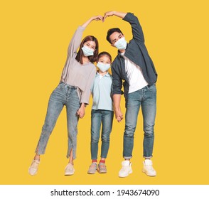 Family In Medical Masks And Showing Love And Protected Gesture Concepts