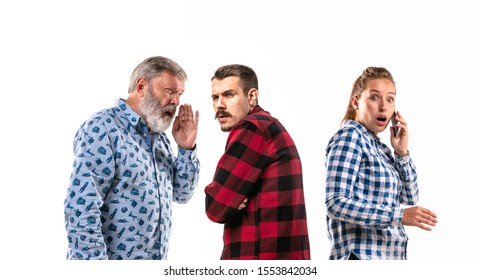 Family Members Arguing With One Another On White Studio Background. Concept Of Human Emotions, Expression, Conflict Of Generations. Woman And Men In Dispute. Half-length Portrait. Copyspace.