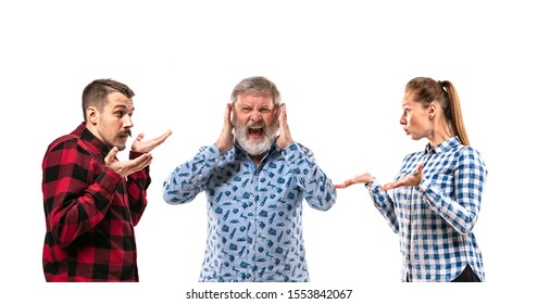 Family Members Arguing With One Another On White Studio Background. Concept Of Human Emotions, Expression, Conflict Of Generations. Woman And Men In Dispute. Half-length Portrait. Copyspace.