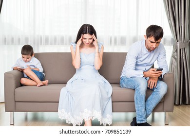 Family Members Distracted By Technology Phone And Lifestyle Concept
