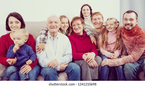 Family Members Making The Family Photo During Reunion Party