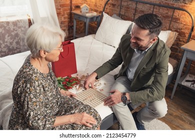 Family Members Playing Wooden Vocabulary Game As A Part Of A Celebration Of Mother's Day Grandparent's Day . High Quality Photo